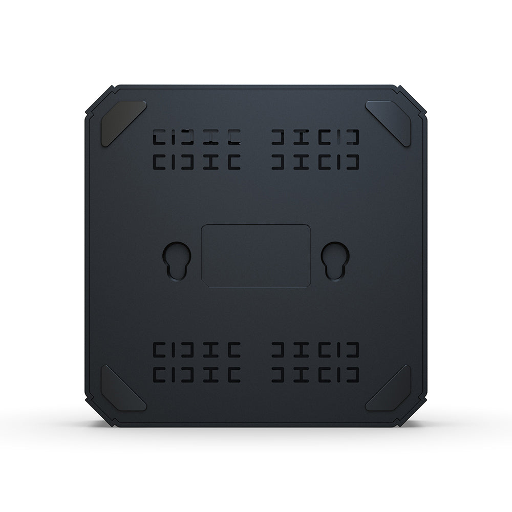 Bottom view of X96Q showing ventilation slots and wall-mount holes for efficient cooling and flexible installation.